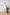 ELAGIA white suit for women deep V-neck sleeveless jumpsuit front view on model