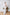 ELAGIA white suit for women sleeveless jumpsuit side angle detail showcasing silhouette