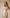 Elara Gold Ruffle-Trim Open-Back Satin Maxi Dress - side view | ELAGIA