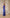 Kaia Blue Satin Halter-Neck Open-Back Maxi Dress - side view | ELAGIA