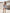 ELAGIA Grey Satin Strapless Mini Dress flat lay - product photography showing dress laid flat on surface