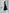 ELAGIA Black Satin Corseted Strapless Dress - three-quarter view displaying fitted bodice and A-line skirt