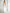 White One-Shoulder Cut-Out Maxi Dress - side view | ELAGIA