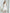 ELAGIA white satin corseted strapless dress back view showing zipper closure and fitted silhouette