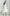ELAGIA white satin corseted strapless dress hem detail showing floor-length design and satin finish
