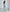 ELAGIA sky-blue satin long sleeve midi dress - side angle of purple business suit women cut in light blue satin