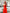 ELAGIA red V-neck jumpsuit full length styled photo - red suit womens modeled with heels and clutch