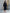 ELAGIA black V-neck puff-sleeve midi dress back view showing zipper closure and tailored fit silhouette