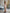 ELAGIA beige off-the-shoulder maxi dress back view showing flowing silhouette and purple business suit women appeal