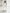 ELAGIA white one-shoulder belted midi dress back view showing zipper closure and fitted silhouette