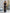 ELAGIA black off-the-shoulder maxi dress lifestyle shot styled as purple business suit women ensemble