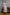 ELAGIA dusty pink satin bow back midi dress front view - feminine sleeveless design in soft blush tone