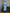 ELAGIA sky-blue satin bow back midi dress lifestyle shot styled for formal occasions and special events