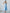 ELAGIA sky-blue satin corseted strapless dress - styled view with model wearing dress for evening occasion