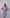 ELAGIA pink off-the-shoulder mini dress back angle showing purple business suit women silhouette