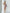 ELAGIA beige one-shoulder feather sleeve mini dress close-up of 3 piece women's suit inspired construction
