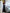 ELAGIA black off-the-shoulder maxi dress lifestyle shot with purple business suit women professional styling