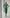 ELAGIA green sweetheart top and midi skirt 2-piece womens suit set - side angle showing flattering fit and drape