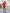 ELAGIA Crimson One-Shoulder Mini Dress styled on model - chic red mini with contemporary one-shoulder cut