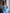 ELAGIA sky-blue satin corseted strapless dress - close-up of corseted bodice construction and satin fabric texture