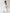Side profile of ELAGIA white tailored blazer from 3 piece women's suit showing structured shoulders