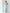 ELAGIA mint jumpsuit back view showing strapless design and flowing wide-leg silhouette in soft blue tone