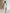 ELAGIA beige off-the-shoulder maxi dress styled look demonstrating purple business suit women professional style