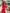 ELAGIA Crimson Silk Long Sleeve Ruched Mini Dress - detail shot of long sleeve cuff and silk fabric drape