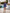 ELAGIA Navy Silk Long Sleeve Ruched Mini Dress - back view showing silhouette of 3 piece women's suit purple business...