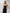 ELAGIA Black Strapless V-Neck Jumpsuit worn by model walking - dynamic women's black suit set in motion