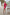 ELAGIA Crimson One-Shoulder Mini Dress hemline detail showing mini length and clean finishing