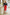 ELAGIA womens red suit set styled mini skirt on model showing fit and drape from front angle