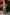 ELAGIA green midi dress lifestyle shot with model in motion - 3 piece women's suit contemporary option