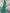 ELAGIA green double breasted suit side profile view of complete 3 piece women's suit blazer and trouser fit on model
