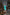 ELAGIA green satin long sleeve mini dress fabric drape and movement detail photography