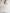 ELAGIA white off-the-shoulder maxi dress front view - 3 piece women's suit style with flowing silhouette