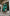 ELAGIA Emerald Satin Cloak Sleeve Mini Dress close-up of satin fabric texture - 3 piece women's suit elegance