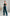 ELAGIA blue jumpsuit emerald bridal pantsuit styled with jewelry showing complete formal look