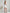 ELAGIA white one-shoulder feather sleeve mini dress - fabric detail showing material texture and feather integration