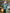 Detail shot of ELAGIA Emerald Satin Long Sleeve Maxi Dress neckline and upper bodice design