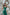 ELAGIA emerald satin wide-leg jumpsuit back view - emerald green jumpsuits showing elegant drape and fit