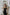 ELAGIA womens black suit - back view of black satin wide-leg jumpsuit displaying elegant drape and cut