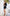 ELAGIA black one-shoulder fringed mini dress close-up of fringe hemline detail - 3 piece women's suit