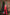 ELAGIA red suit womens - full body styled shot of deep V-neck sleeveless jumpsuit with accessories