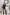 ELAGIA Alexa Black Promo Slim-Fit Suit 2-Piece lifestyle shot in boardroom setting with purple business suit women