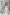ELAGIA white sleeveless jumpsuit side angle view showing deep V-neck and wide leg silhouette