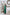 ELAGIA Emerald Satin Long Sleeve Maxi Dress hemline detail showing floor-length satin finish