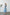 ELAGIA sky-blue backless puff-sleeve midi dress - three-quarter view showing silhouette, purple business suit women