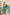 ELAGIA Emerald Satin Long Sleeve Mini Dress - side angle highlighting fitted waist and emerald color detail