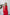 ELAGIA red thigh-slit maxi dress back view showing flowing silhouette and zipper closure